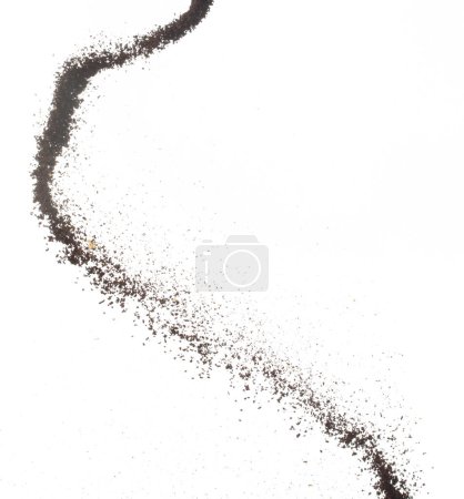 Coffee powder fly explosion, Coffee crushed ground float pouring, wave like smoke smell. Coffee ground powder splash throwing in mid Air. White background Isolated high speed shutter, freeze motion