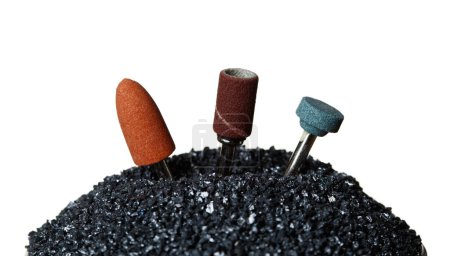 Silicon Carbide show with sharpening tools device. Black Silicon Carbide pile and top with spinning tools to sharpening surface material, White background Isolated particle element object