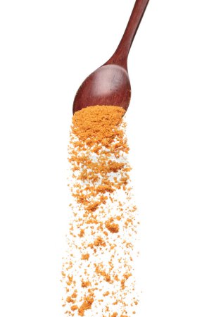 Chinese Ma La flavor falling from spoon, Ma la Spices and seasoning powder splash in mid air. Seasoning powder spice up taste of food over white background isolated
