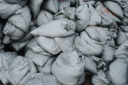 Photo for Pile sandbags for flood protection or military use. - Royalty Free Image