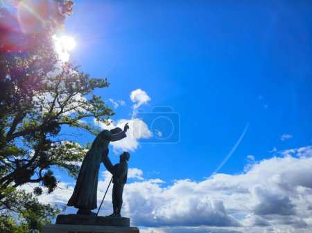 Statue of Saint jean marie vianney meeting Antoine Givre, the holy priest of ars, France