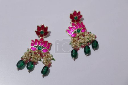 Photo for Top view of  earrings on white - Royalty Free Image