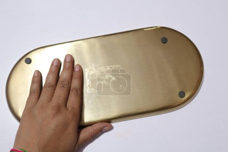 Photo for Hand touching metal tray - Royalty Free Image