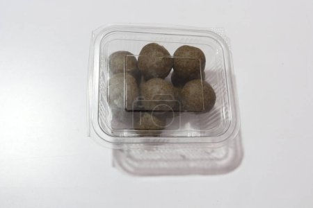 Photo for View of indian sweet balls in plastic box - Royalty Free Image