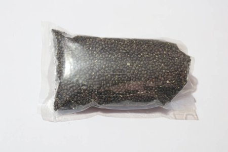 Photo for View of Black horse gram seeds in plastic bag - Royalty Free Image