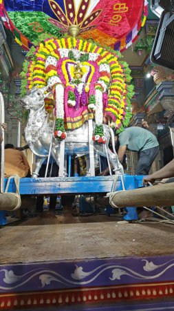 Photo for People worhsiping sacred Hindu God idol decorated with floral garland, Arunachalesvara Swamy Temple Karthika Deepam Festival at Thiruvannamalai in Tamil Nadu, India - Royalty Free Image