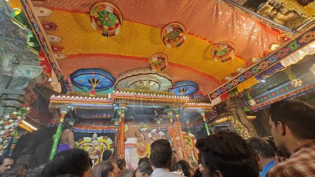 Photo for TAMIL NADU, INDIA - NOVEMBER 26, 2023: people worhsiping sacred Hindu Gods idols decorated with floral garland, Arunachalesvara Swamy Temple Karthika Deepam Festival at Thiruvannamalai in Tamil Nadu, India - Royalty Free Image