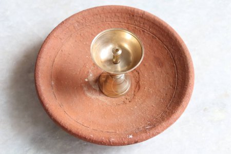 Brass Metal Diya for Puja Isolated on White Background