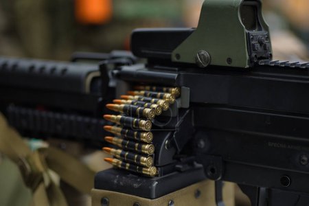 airsoft weapon machine gun, staged photo of airsoft equipment, military theme