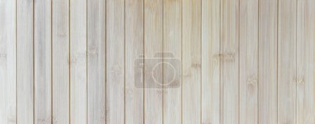 Téléchargez les photos : Panorama de la texture de la planche de bambou brun gros plan pour l'arrière-plan - en image libre de droit