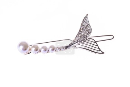 Silver hair clip with pearls and rhinestones isolated on white background.