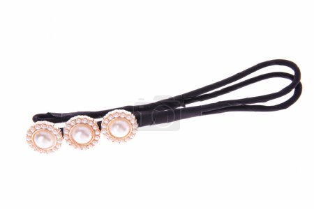 Black bobby pin with decorative pearls isolated on white background.
