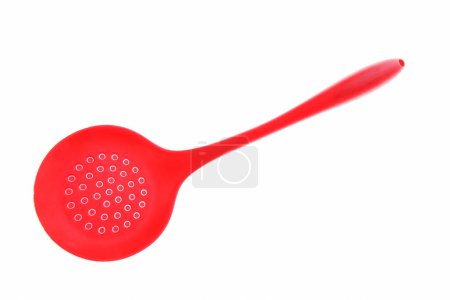 Red colander with plastic handle isolated on white background.
