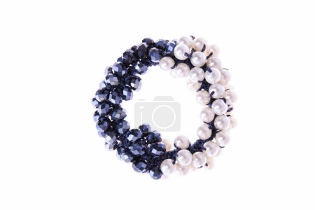 Hair elastic with blue and white beads on  isolated background.