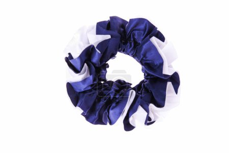 Blue and white hair scrunchie on isolated background.