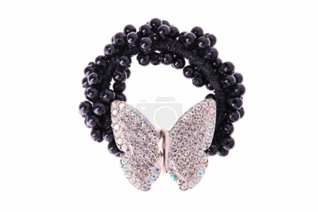 hair elastic with black beads and butterfly with rhinestones isolated on white background.