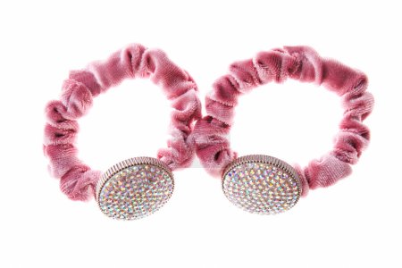 Pink hair elastic with circle with rhinestones isolated on white background.