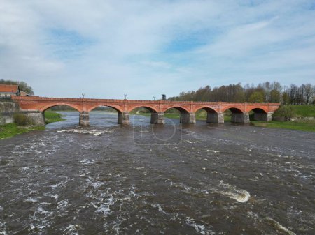 The old red brick bridge across the Venta river. Kuldiga, Latvia