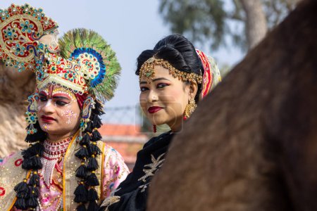 Photo for Bikaner, Rajasthan, India - January 2023: Camel Festival Bikaner, Group of young beautiful women in traditional dress and jewellery of rajasthan while participating in the parade. Selective focus. - Royalty Free Image