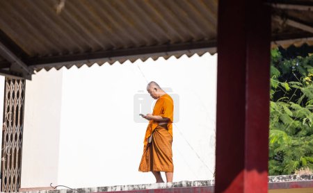 Photo for Sarnath, Uttar Pradesh, India - November 2022: Portrait of an tibetan monk in temple at sarnath. - Royalty Free Image