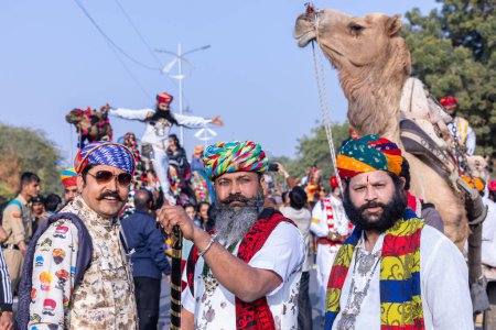 Photo for Bikaner, Rajasthan, India - January 13 2023: Camel Festival, Portrait of an young rajasthani male with beard and moustache wearing white traditional rajasthani dress and turban. - Royalty Free Image