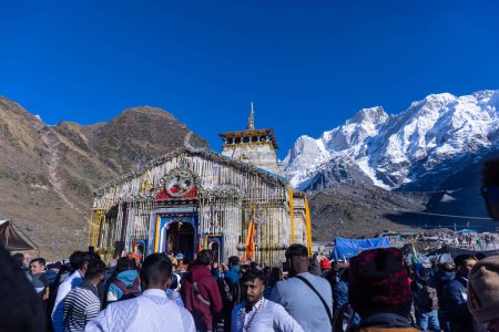 Photo for Kedarnath, Uttarakhand, India - October 14, 2022: Baba kedarnath temple with snow covered himalayan mountains in background. Kedarnath temple is one of the lord shiva jyotirlinga and sacred place - Royalty Free Image