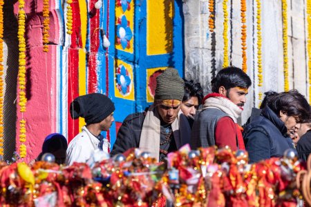 Photo for Kedarnath, Uttarakhand, India - October 15 2022: Devotees performing hindu rituals outside the holy shrine baba kedarnath temple - Royalty Free Image