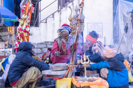 Photo for Kedarnath, Uttarakhand, India - October 15 2022: Devotees performing hindu rituals outside the holy shrine baba kedarnath temple - Royalty Free Image