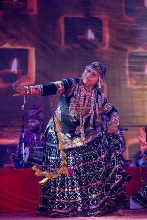 Photo for Pushkar, Rajasthan, India - November 05 2022: Portrait of famous rajasthani folk artist Gulabo Sapera performing tribal folk dance Kalbelia at pushkar fair in traditional dress and jewellery - Royalty Free Image