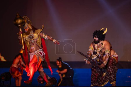 Photo for Ghaziabad, Uttar Pradesh, India - October 23 2023 : Portrait of male artists playing character of hindu god hanuman in a fighting scene with devil of ramayana in ramlila during the dussehra festival - Royalty Free Image