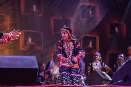 Photo for Pushkar, Rajasthan, India - November 05, 2022: Portrait of rajasthani girl performing tribal folk dance Kalbelia at pushkar fair - Royalty Free Image