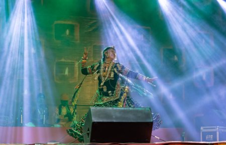 Photo for Pushkar, Rajasthan, India - November 05, 2022: Portrait of famous rajasthani folk artist gulabo sapera performing tribal folk dance Kalbelia at pushkar fair in traditional dress and jewellery - Royalty Free Image