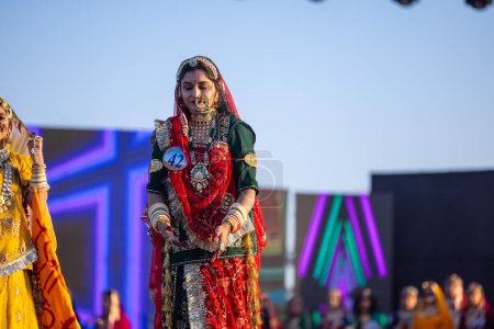 Photo for Bikaner, Rajasthan, India - January 14, 2023: Portrait of young beautiful indian woman in ethnic rajasthani lehenga choli dress participating in miss marwar fashion show during bikaner camel festival - Royalty Free Image