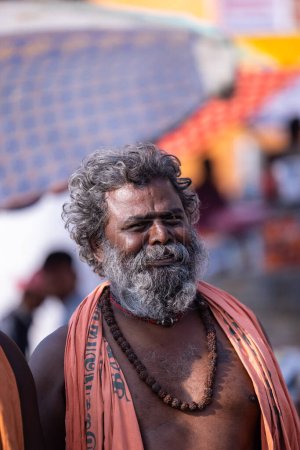 Photo for Varanasi, Uttar Pradesh, India - March 05 2023: Portrait of old holy south indian brahmin male in tat dashashwamedh ghats near river ganges in varanasi - Royalty Free Image