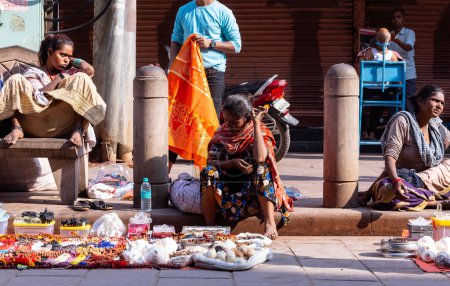 Photo for Varanasi, Uttar Pradesh, India - March 05 2023: Portrait of indian female street hawker selling their products on the streets of varanasi - Royalty Free Image