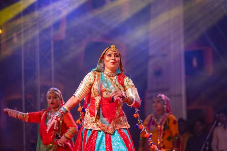 Photo for Pushkar, Rajasthan, India - November 06 2022: Beautiful female artists performing rajasthani folk dance on stage at pushkar fair in colorful ethnic rajasthani dresses and jewellery. - Royalty Free Image