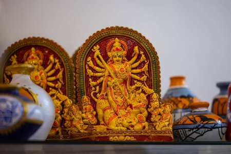 Idol of goddess durga made with clay on display for same at trade fair. 