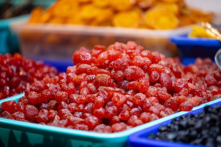 Photo for Colourful redkberry fruits for sale on display at trade fair. - Royalty Free Image