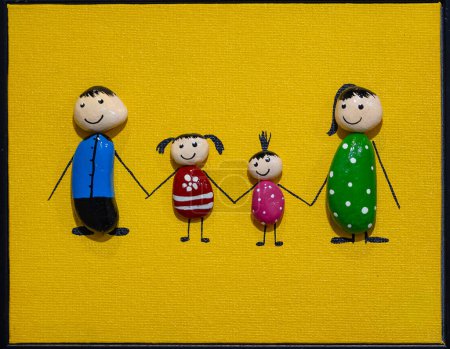 Handmade painting of family on wooden canvas with yellow background.