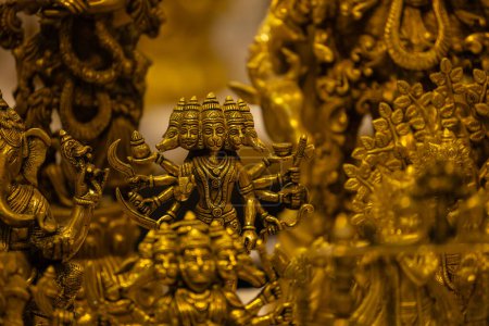 Brass metal art, Handmade Indian Lord Hanuman sculpture souvenir made with brass with plain background. Selective focus.