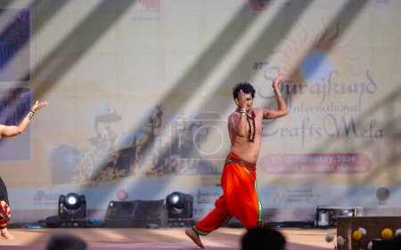 Photo for Faridabad, Haryana, India - February 17 2024: Portrait of male south indian artist performing classical dance kuchipudi on stage at surajkund craft fair. - Royalty Free Image