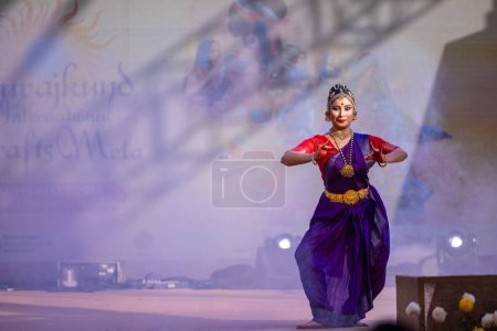Photo for Faridabad, Haryana, India - February 17 2024: Portrait of a female south indian artist performing classical dance kuchipudi at surajkund craft fair in traditional saree and jewellery. - Royalty Free Image