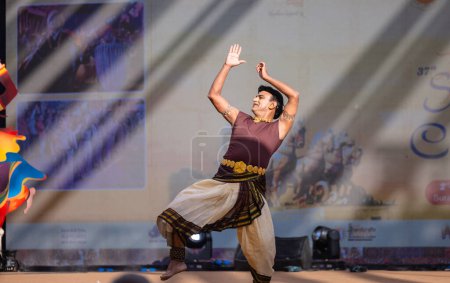 Photo for Faridabad, Haryana, India - February 17 2024: Portrait of male south indian artist performing classical dance kuchipudi on stage at surajkund craft fair. - Royalty Free Image