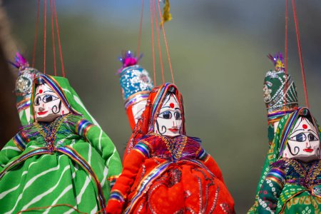 Photo for Indian colorful Rajasthani handmade Puppets and Crafts products hanging on display. Selective focus. - Royalty Free Image