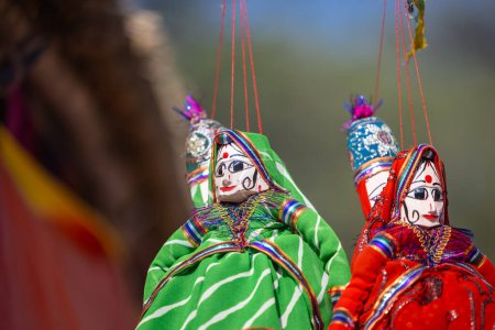 Photo for Indian colorful Rajasthani handmade Puppets and Crafts products hanging on display. Selective focus. - Royalty Free Image