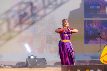 Photo for Faridabad, Haryana, India - February 17 2024: Portrait of a female south indian artist performing classical dance kuchipudi at surajkund craft fair in traditional saree and jewellery. - Royalty Free Image