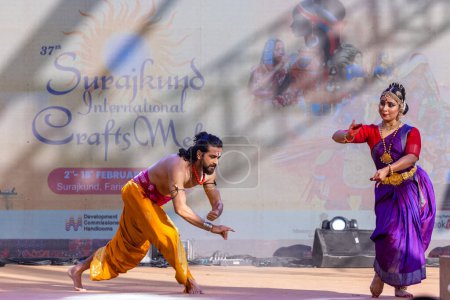 Photo for Faridabad, Haryana, India - February 17 2024: Portrait of male and female south indian artist performing classical dance kuchipudi on stage at surajkund craft fair. - Royalty Free Image