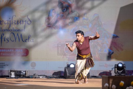 Photo for Faridabad, Haryana, India - February 17 2024: Portrait of male south Indian artist performing classical dance kuchipudi on stage at surajkund craft fair. - Royalty Free Image