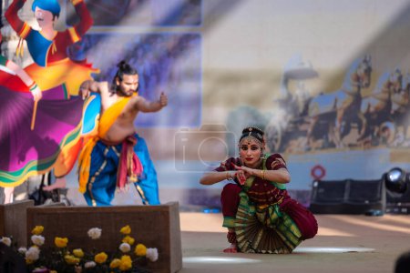 Photo for Faridabad, Haryana, India - February 17 2024: Portrait of male and female south indian artist performing classical dance kuchipudi on stage at surajkund craft fair. - Royalty Free Image