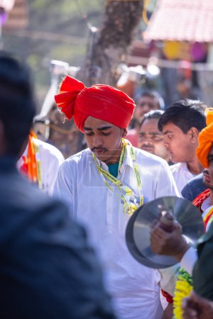 Foto de Faridabad, Haryana, India - February 17 2024: Portrait of male folk artist of haryana playing musical instrument during surajkund craft fair to entertain tourists. - Imagen libre de derechos